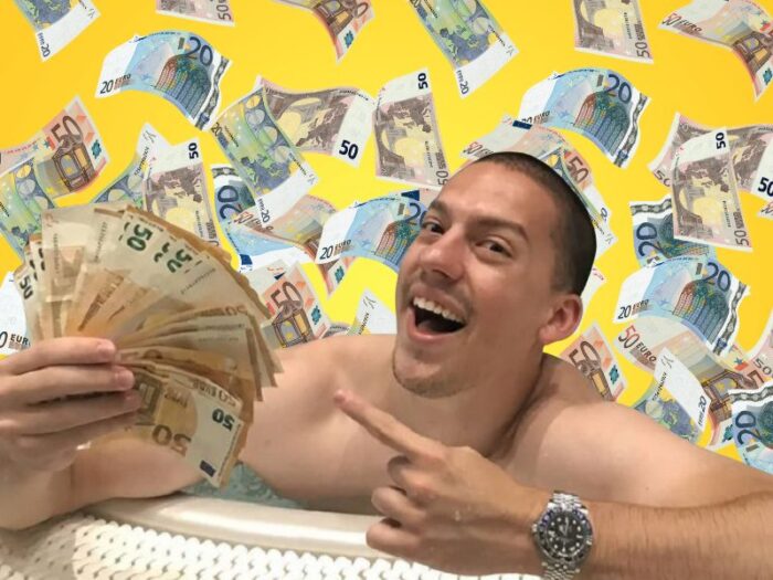 Srpski jutjuber Bogdan Ilić drži novac u ruci, u pozadini pare koje lete